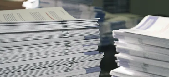Stacks of offset-printed booklets
